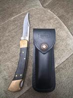 Buck 110 Vouwmes met Vingergroeven en Leren Schede, Ophalen of Verzenden, Gebruikt