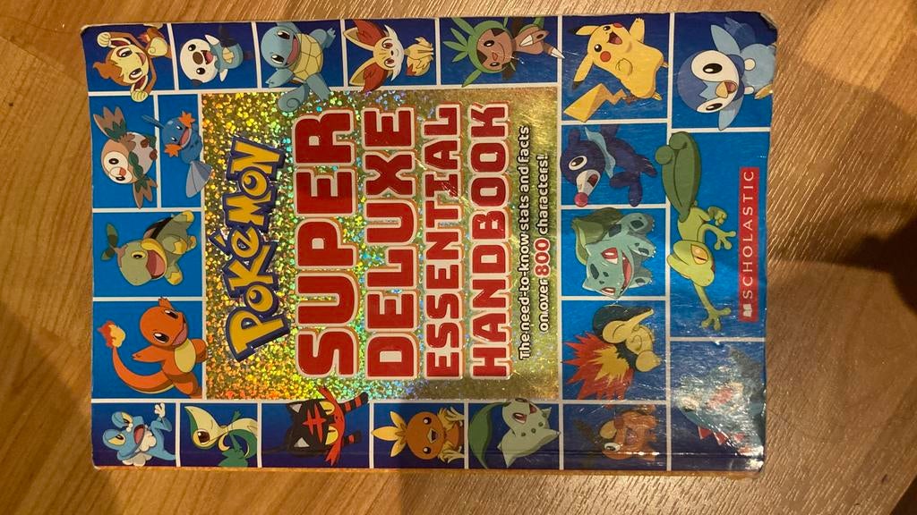 Pokemon: Super Deluxe Essential Handbook, Boeken, Hobby en Vrije tijd, Ophalen of Verzenden, Zo goed als nieuw, Overige onderwerpen