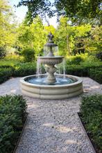 Compacte leeuwkoppen fontein met rand