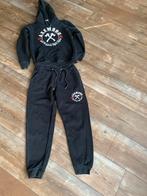AxeWood Trainingspak Zwart, Ophalen of Verzenden, Zo goed als nieuw, Jongen of Meisje, Sport- of Zwemkleding