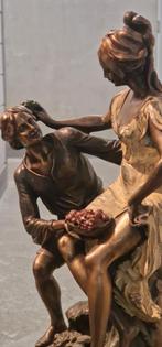 Brons beeld man en vrouw., Ophalen