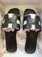 Nieuwe Hermes Oran Sandalen Maat 41 - Zwart, Kleding | Dames, Schoenen, Ophalen of Verzenden, Nieuw, Zwart, Slippers