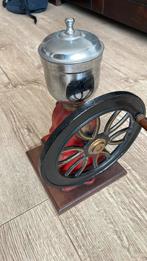 Antieke gietijzeren koffiemolen, Ophalen