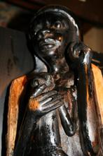 houten beeld uit Afrika?, Ophalen