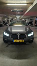 BMW 1-Serie (f40) 118i Business Edition 136pk Aut 2021 Grijs, Auto's, Origineel Nederlands, Te koop, Zilver of Grijs, 5 stoelen