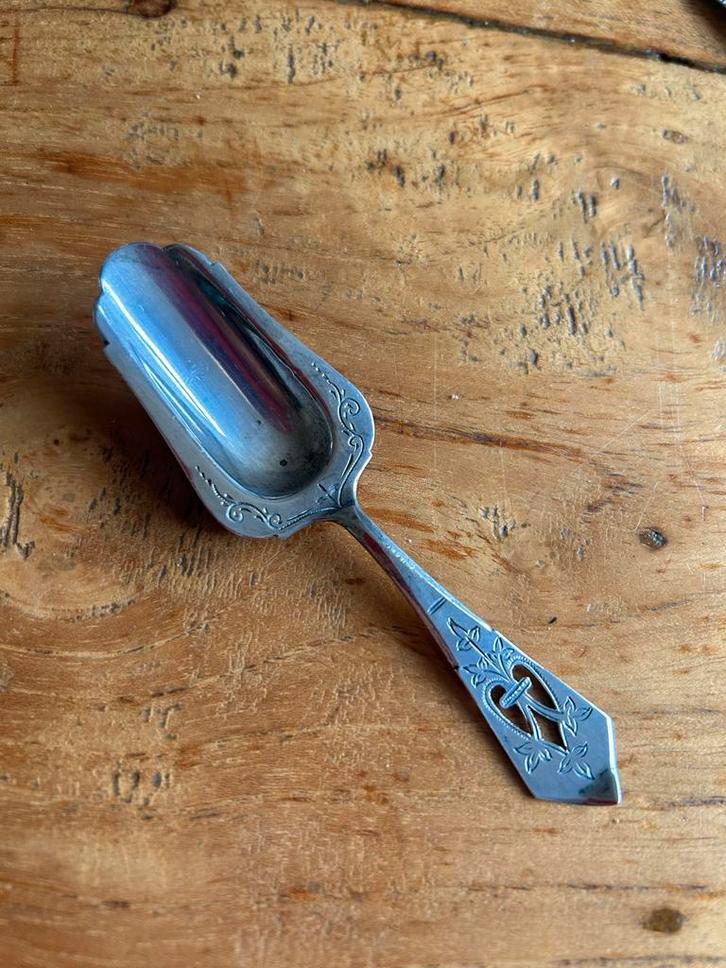 Zilveren Suikerlepeltje met Sierlijk Design, Antiek en Kunst, Antiek | Bestek, Ophalen of Verzenden