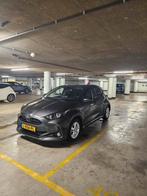 Toyota Yaris 1.5 Hybrid 116pk CVT 2021 Grijs, Auto's, Zwart, 450 kg, 1490 cc, 48 €/maand