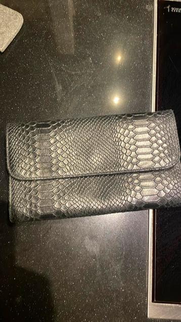 Clutch van leer zwart beschikbaar voor biedingen