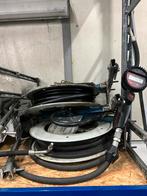 Olieslanghaspel met meter, Ophalen