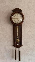 Houten wandklok met slinger Warmink., Ophalen