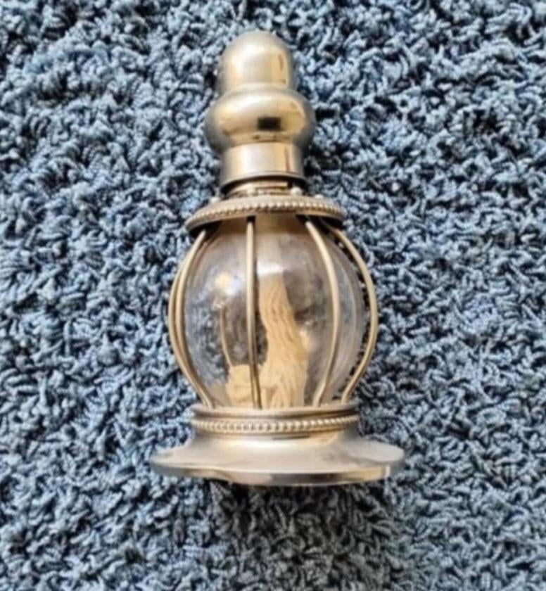 Olie lampje van metaal en glas, Ophalen