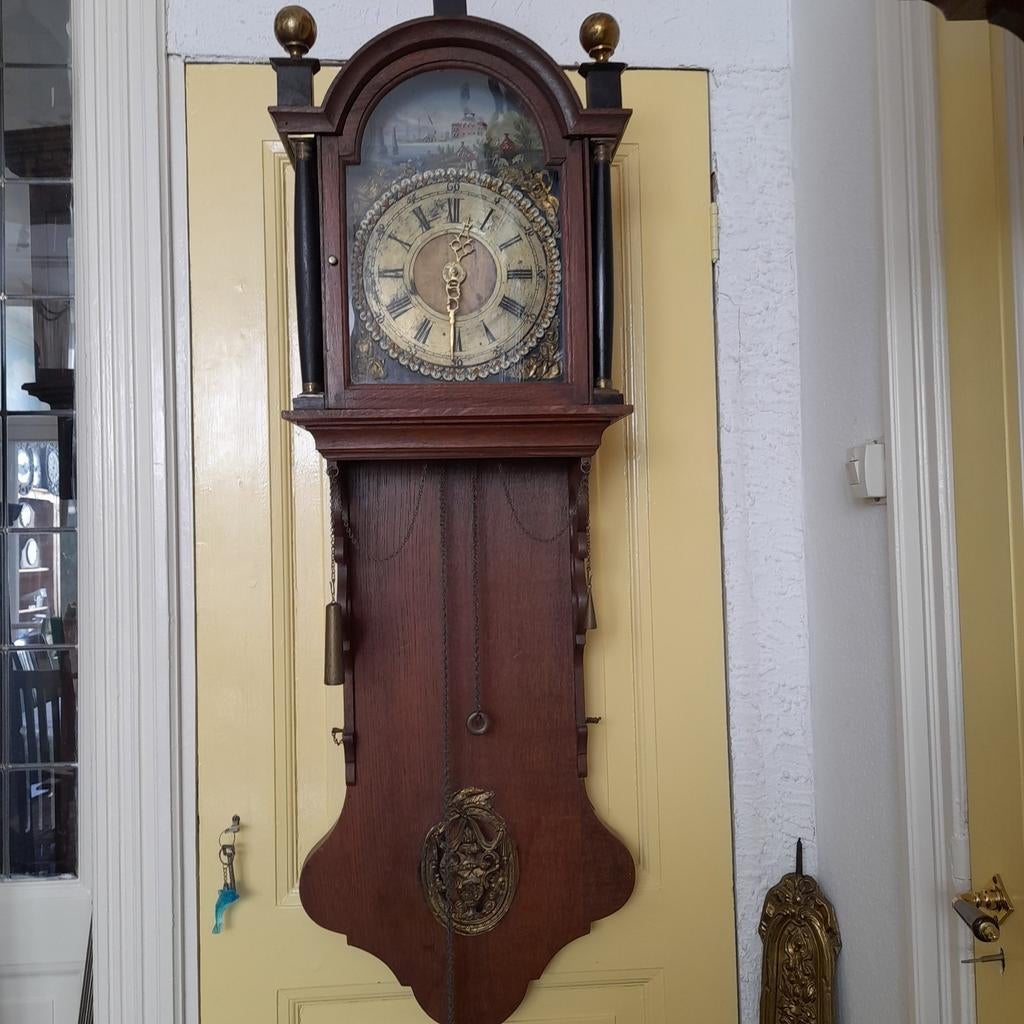 Antieke Friese staartklok met dubbele bel, Ophalen