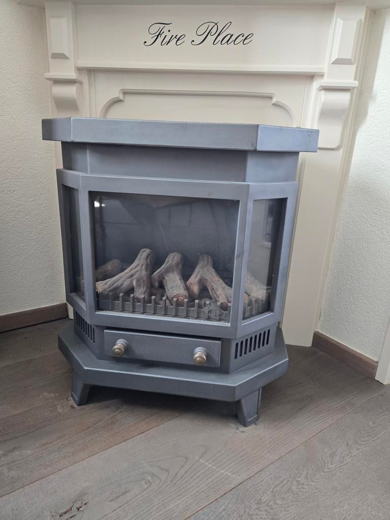 Gaskachel met houtblokken, Ophalen