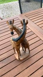 Houtsnijwerk giraffen, Ophalen