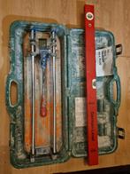 Tegelsnijder met toebehoren, Ophalen