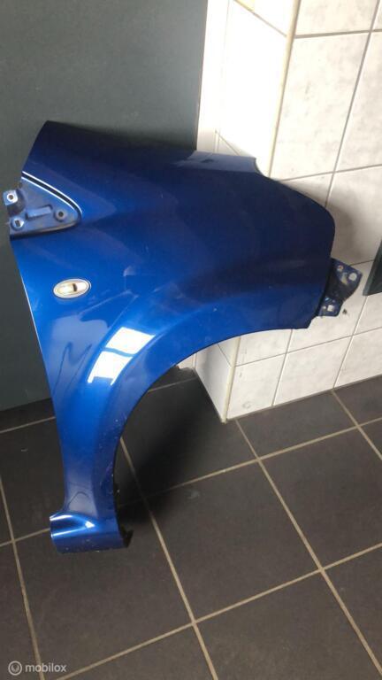 Zijscherm rechts blauw metallic Toyota Aygo I ('05-'14), Auto-onderdelen, Carrosserie en Plaatwerk, Toyota, Gebruikt, Ophalen of Verzenden