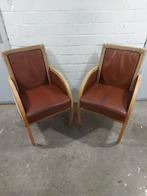 Twee vintage Lloyd Loom fauteuils met lederen zitting, Huis en Inrichting, Stoelen, Ophalen, Gebruikt, Twee, Bruin