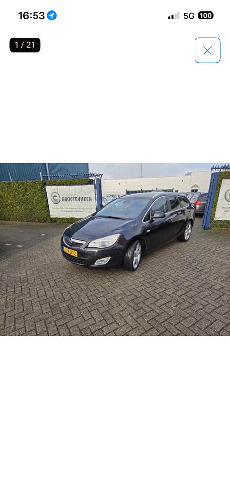 Opel Astra Sports Tourer 1.4 Turbo Cosmo, Auto's, Voorwielaandrijving, Zwart, 4 cilinders, Leder en Stof