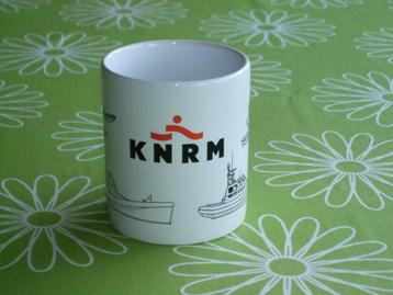 KNRM mok met diverse tekende reddingsboten / schepen