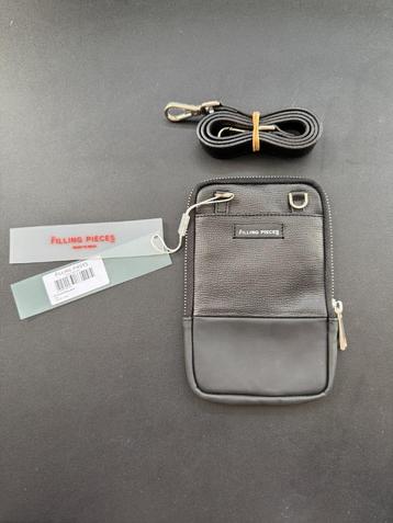 Filling Pieces Passport Bag Black beschikbaar voor biedingen