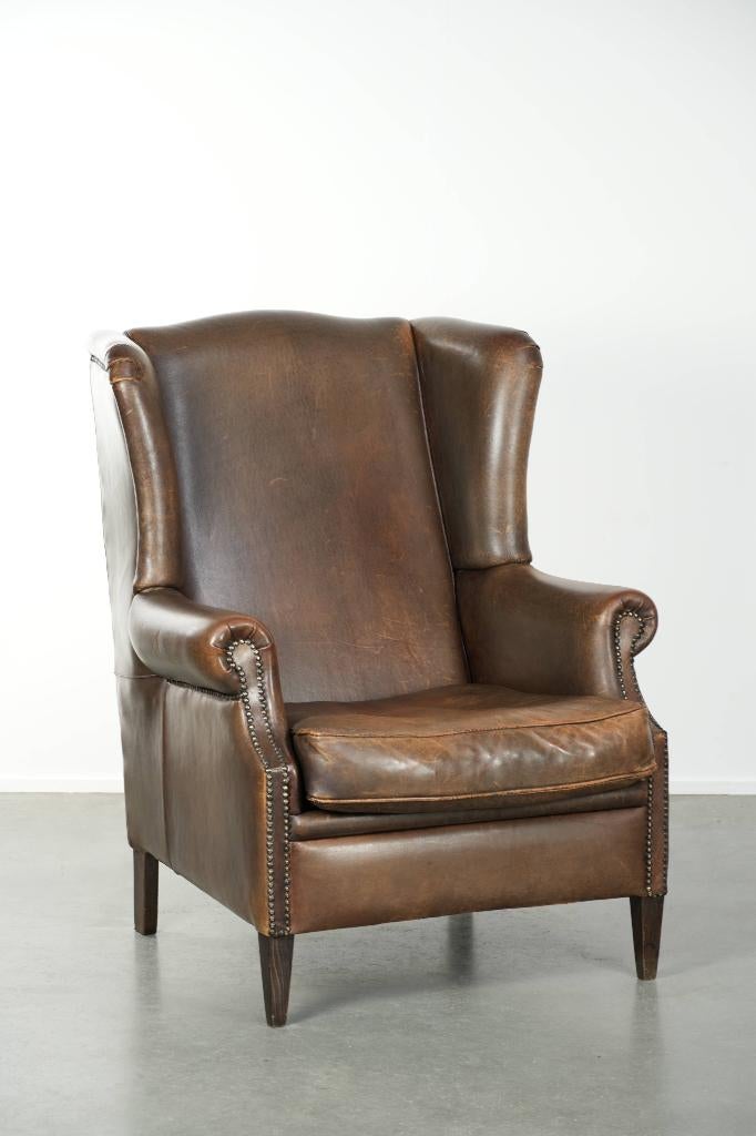 Grote schapenleren oorfauteuil met mooie warme kleuren, Huis en Inrichting, Fauteuils, Gebruikt, Leer, 75 tot 100 cm, 75 tot 100 cm
