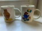 2 bekers/ mokken Douwe Egberts Paddington bear 2009, Ophalen of Verzenden, Nieuw, Overige stijlen, Kop(pen) en/of Schotel(s)