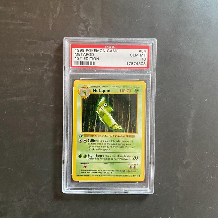 Pokémon #54 Metapod Base Set 1st Edition PSA 10, Hobby en Vrije tijd, Verzamelkaartspellen | Pokémon, Zo goed als nieuw, Ophalen of Verzenden
