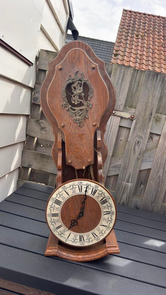 Antieke Zaanse klok met Atlas figuur, Hermle uurwerk, Ophalen