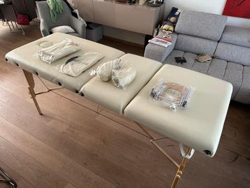 Opklapbare massagetafel beschikbaar voor biedingen
