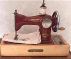 Antieke kleine naaimachine, Ophalen