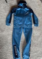 Touzani pak maat 140 blauw jas en broek, Kinderen en Baby's, Kinderkleding | Maat 140, Ophalen of Verzenden, Zo goed als nieuw