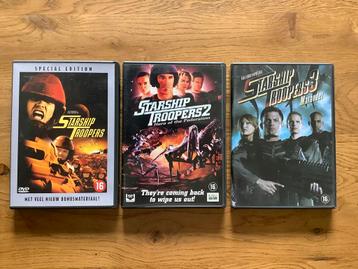 1). Paul Verhoeven's, STARSHIP TROOPERS de delen 1 - 2 - 3. beschikbaar voor biedingen