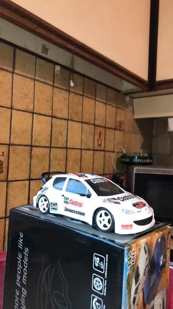 RC Peugeot 206 WRC CASTROL RACING 1/28 NAGELNIEUW beschikbaar voor biedingen
