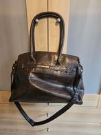 Bruine Daniel Ray Handtas, Ophalen