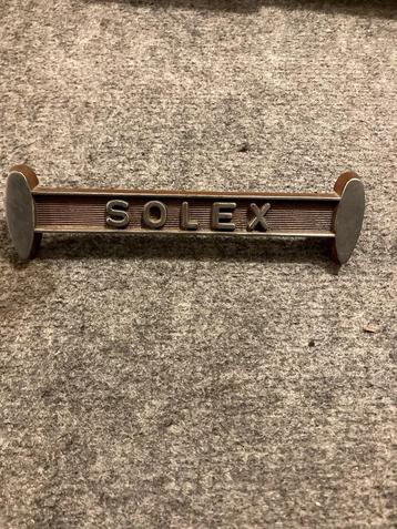 Plaatje groene Solex op motorbeugel beschikbaar voor biedingen