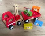 Houten vrachtwagen met takel en magneetblokken, Ophalen