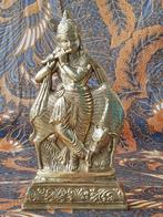 Mooi oud koper beeldje uit India van Krishna 22 cm.