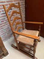 Schommelstoel rieten zitting, Ophalen