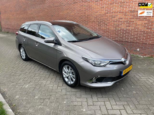 Toyota Auris Touring Sports 1.8 Hybrid Lease pro Navi Cruise, 28 km/l, Gebruikt, Bruin, Multifunctioneel stuurwiel
