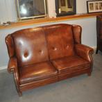 Hoge schapenleren bank met oren, Ophalen