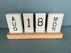 Houten kalender, Ophalen