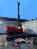 Grond en heiwerk, plaatsen stalen buispalen