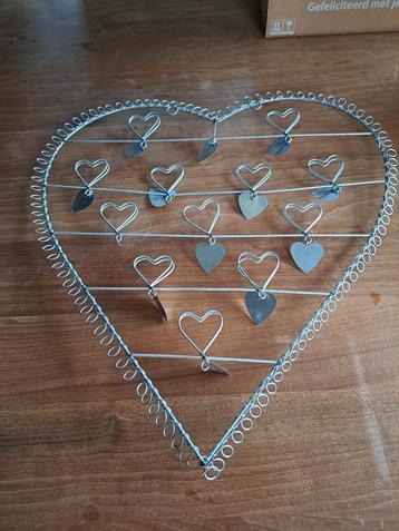 Hartvormig fotorek met klemmetjes beschikbaar voor biedingen