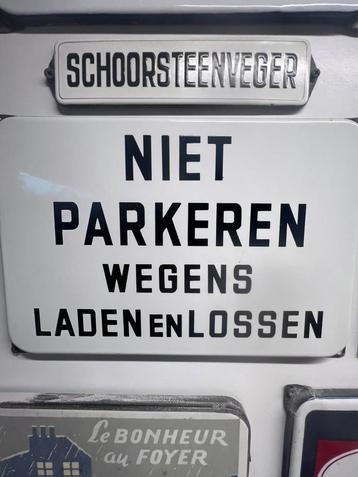 Zwart wit emaille bordje reclame beschikbaar voor biedingen
