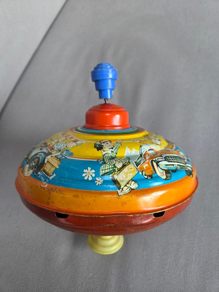 oude blikken speelgoed tol, Ophalen of Verzenden