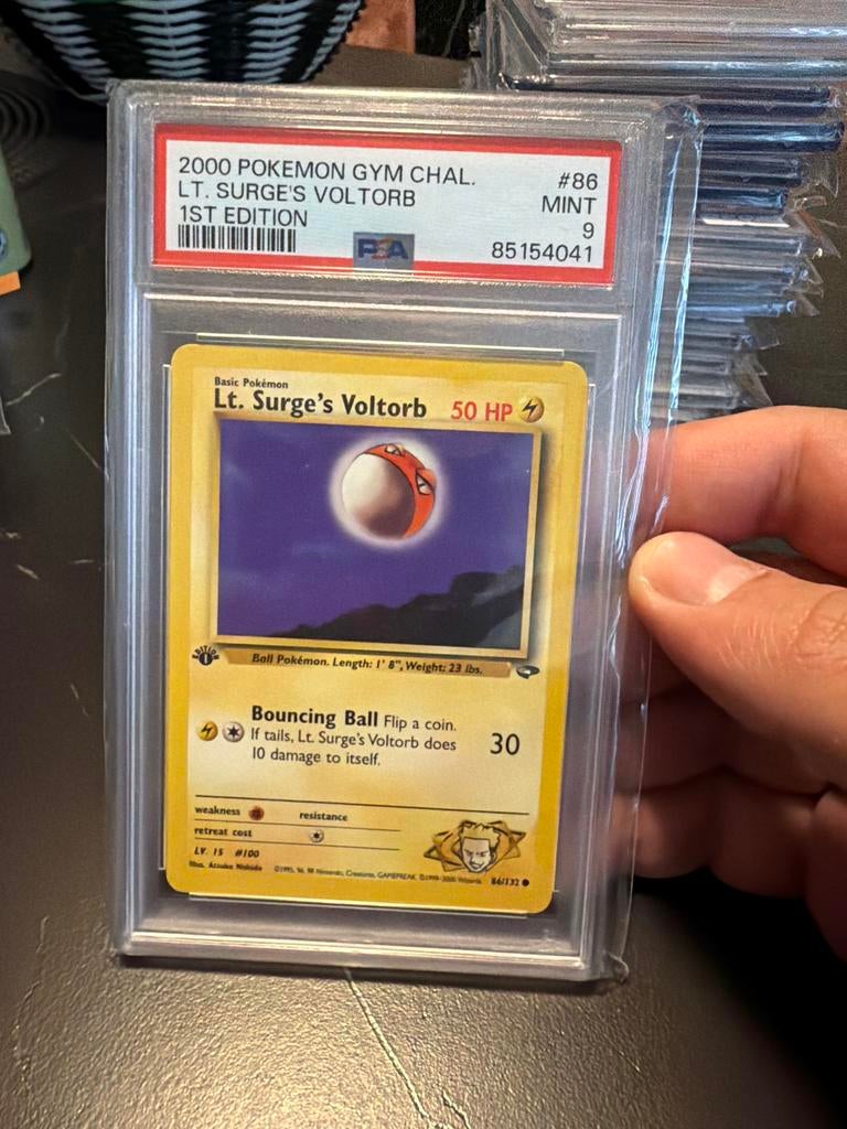 Lt. Surge's Voltorb 1st Edition PSA 9, Ophalen of Verzenden, Zo goed als nieuw, Losse kaart
