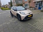 Toyota Aygo X 1.0 Vvt-i MT 72pk 2024 automaat, Beige bj 2024, Auto's, Toyota, Stof, 4 stoelen, Beige, Origineel Nederlands
