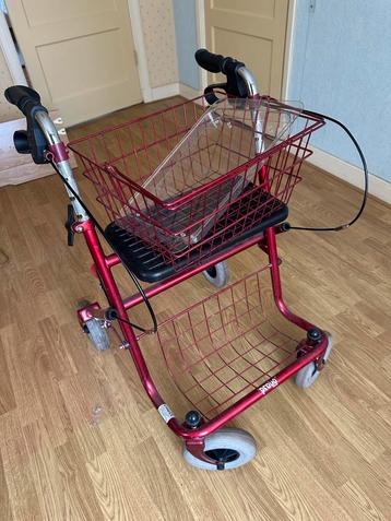 Mooie donkerrode rollator, provo premis beschikbaar voor biedingen