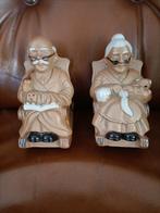 2 vintage spaarpotten. Opa en oma op schommelstoel., Verzamelen, Spaarpotten, Ophalen, Gebruikt, Overige thema's