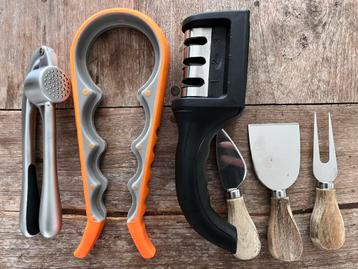 Garlic press, knife sharpner, cheese knives, jar opener.